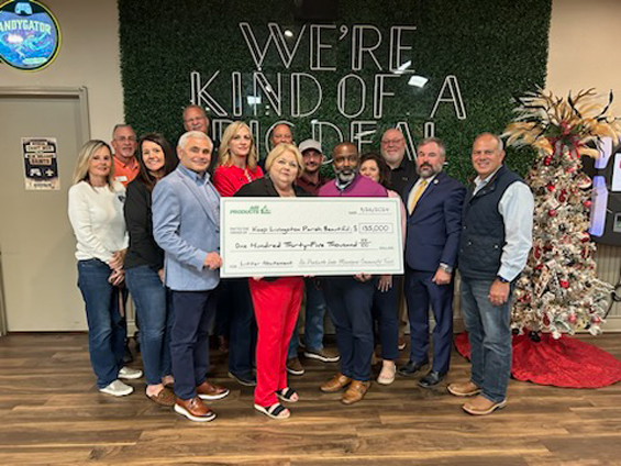 Representatives from Keep Livingston Beautiful, along with Livingston Parish president, holding check from the Air Products Lake Maurepas Community Fund 