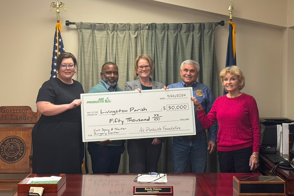 Air Products employees join Livingston Parish President Randy Delatte for a check presentation